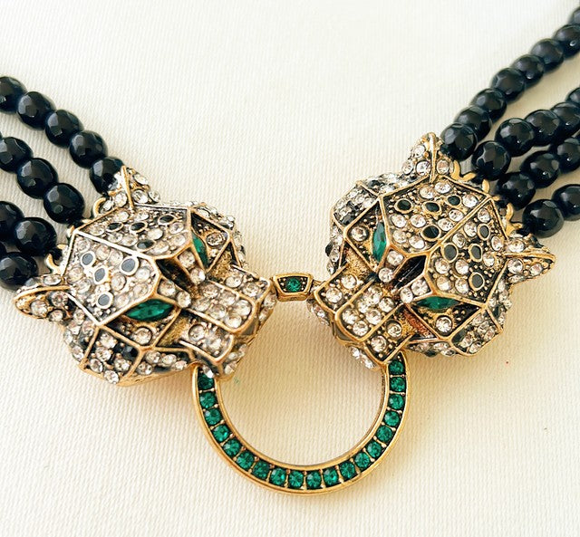 Striking statement double leopard necklace.