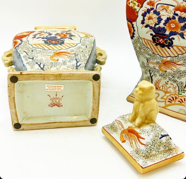 Pair of vintage Imari style vases with foo dog style lids.