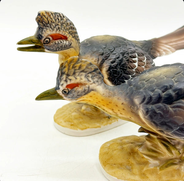 Pair of vintage stamped Royal CrownRoad Runner birds