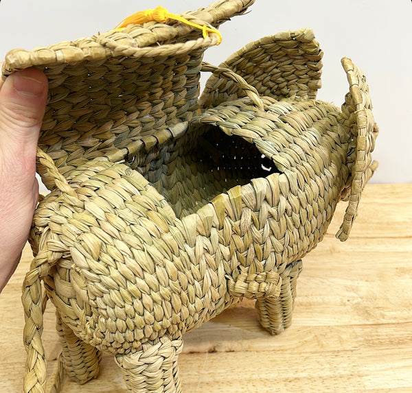 Fun woven elephant purse with yellow tassel.