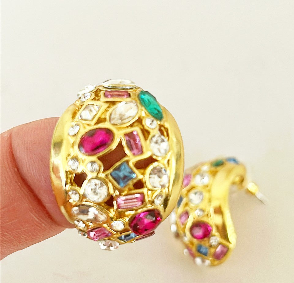 Beautiful half dome shaped pierced style earrings in a gold tone metal and multi colored stone & gripoix style accents.