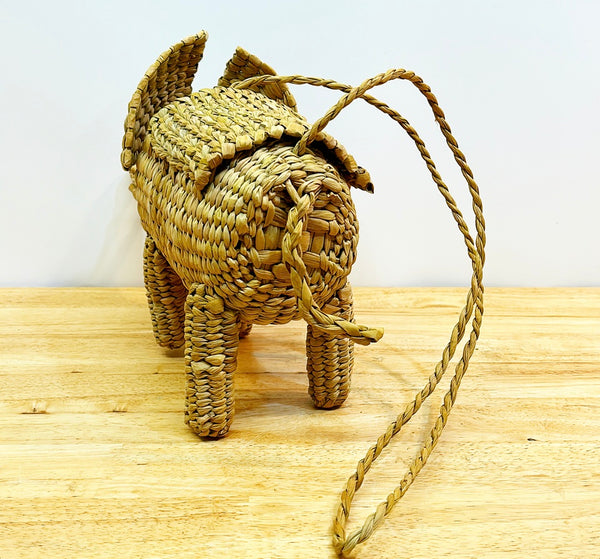 Fun woven elephant purse with yellow tassel.