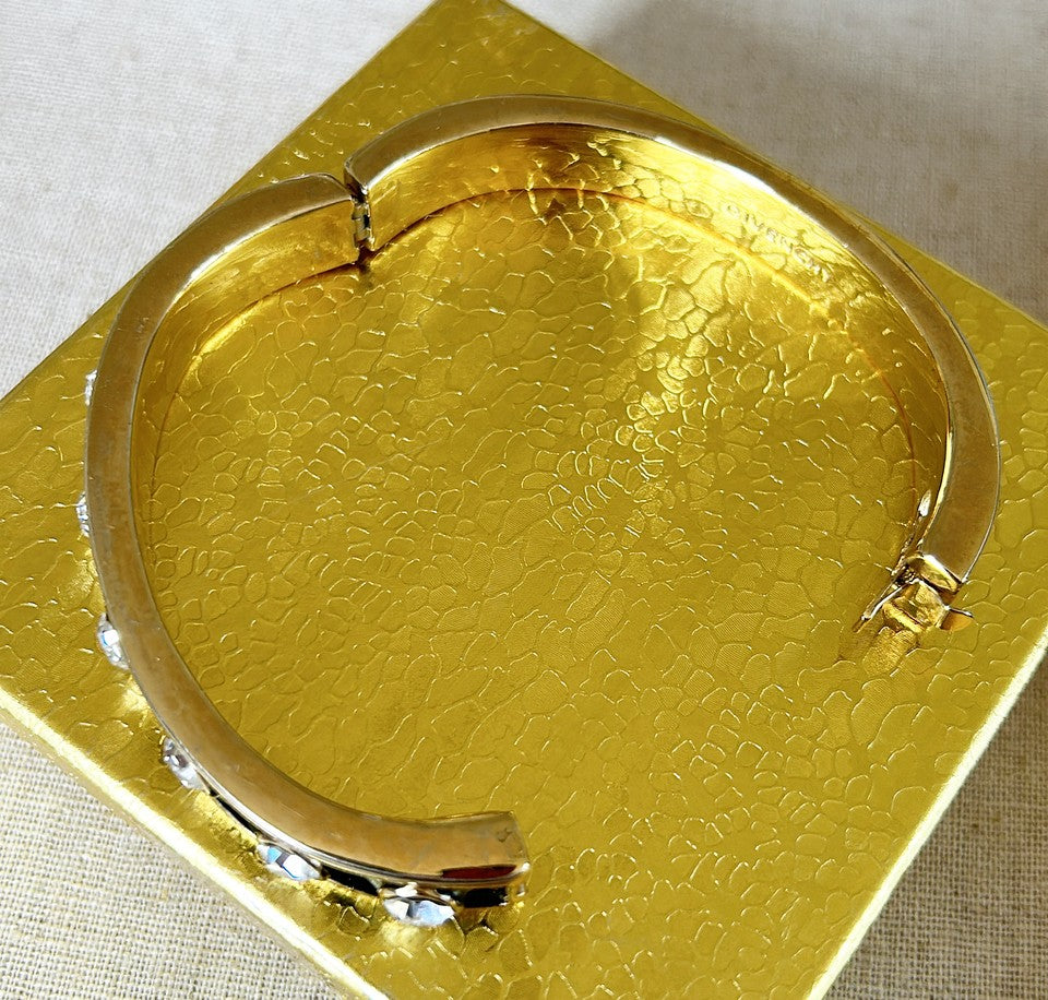 Rare early 90s stamped GIVENCHY bangle bracelet with working clasp that opens.