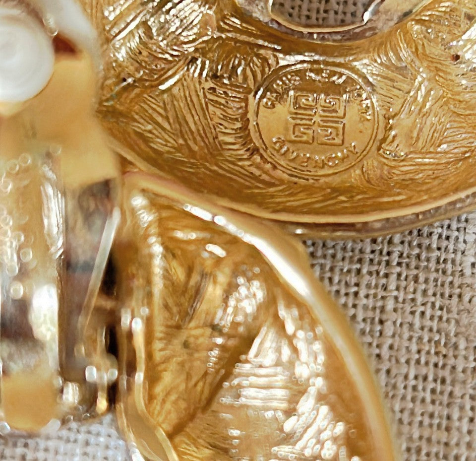 Amazing 1980s stamped GIVENCHY clip on style statement size door knocker style earrings.