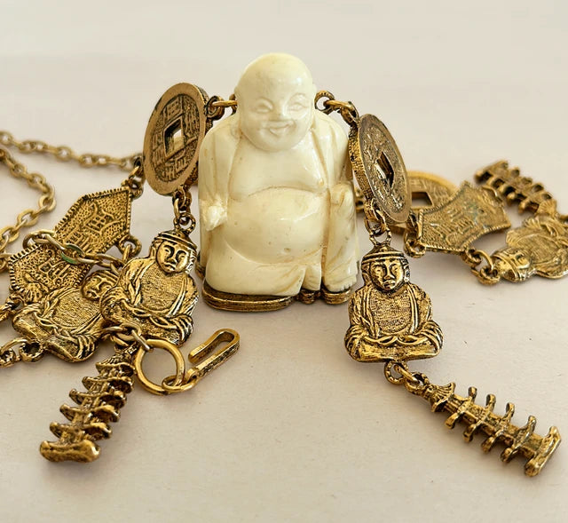 Vintage mid century modern 1960s signed Trifari Chinese faux carved Buddha coin necklace.