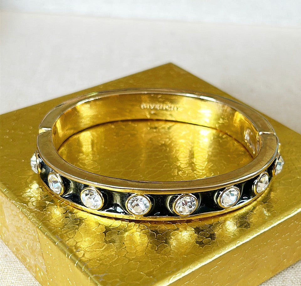 Rare early 90s stamped GIVENCHY bangle bracelet with working clasp that opens.