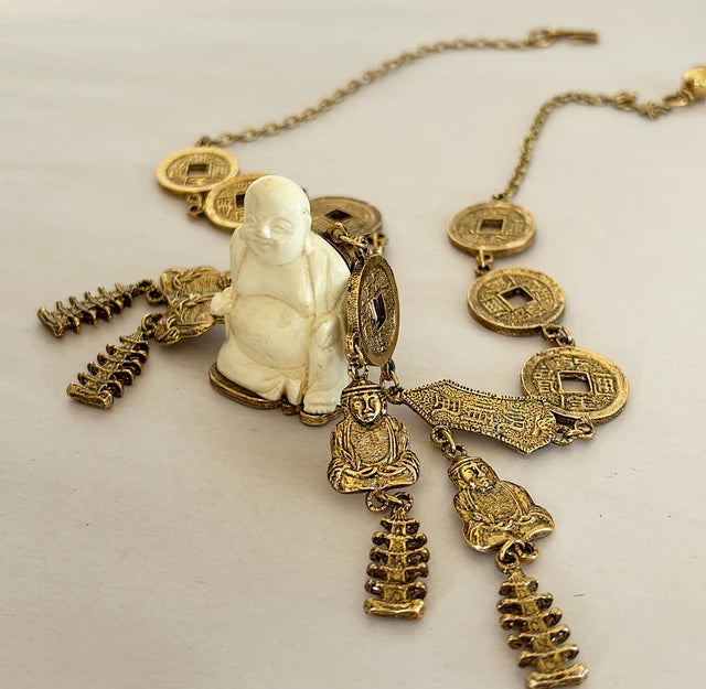 Vintage mid century modern 1960s signed Trifari Chinese faux carved Buddha coin necklace.