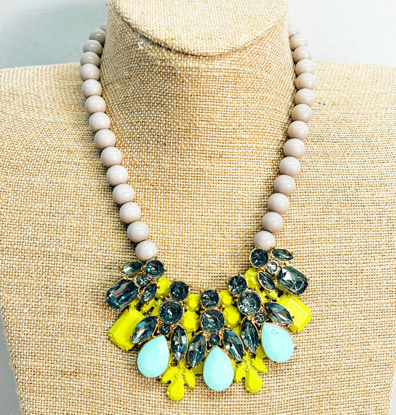 Vintage statement necklace with gray beaded details.