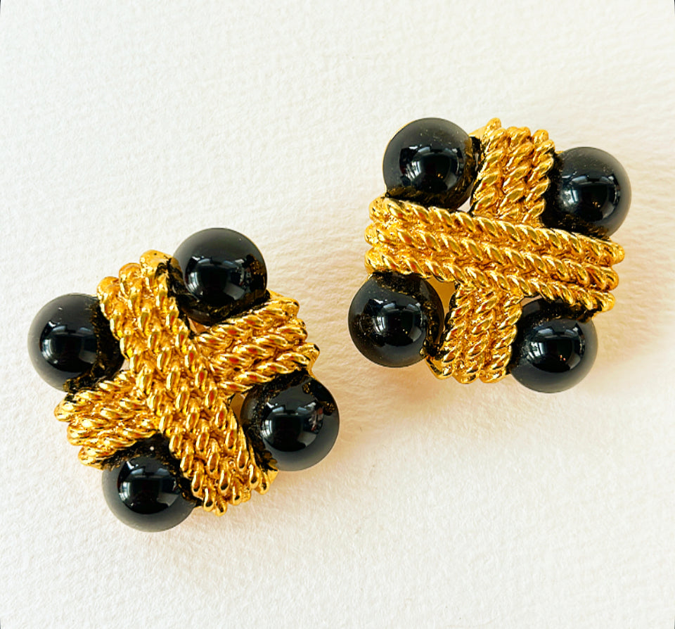 Vintage statement clip-on earrings by Carlisle