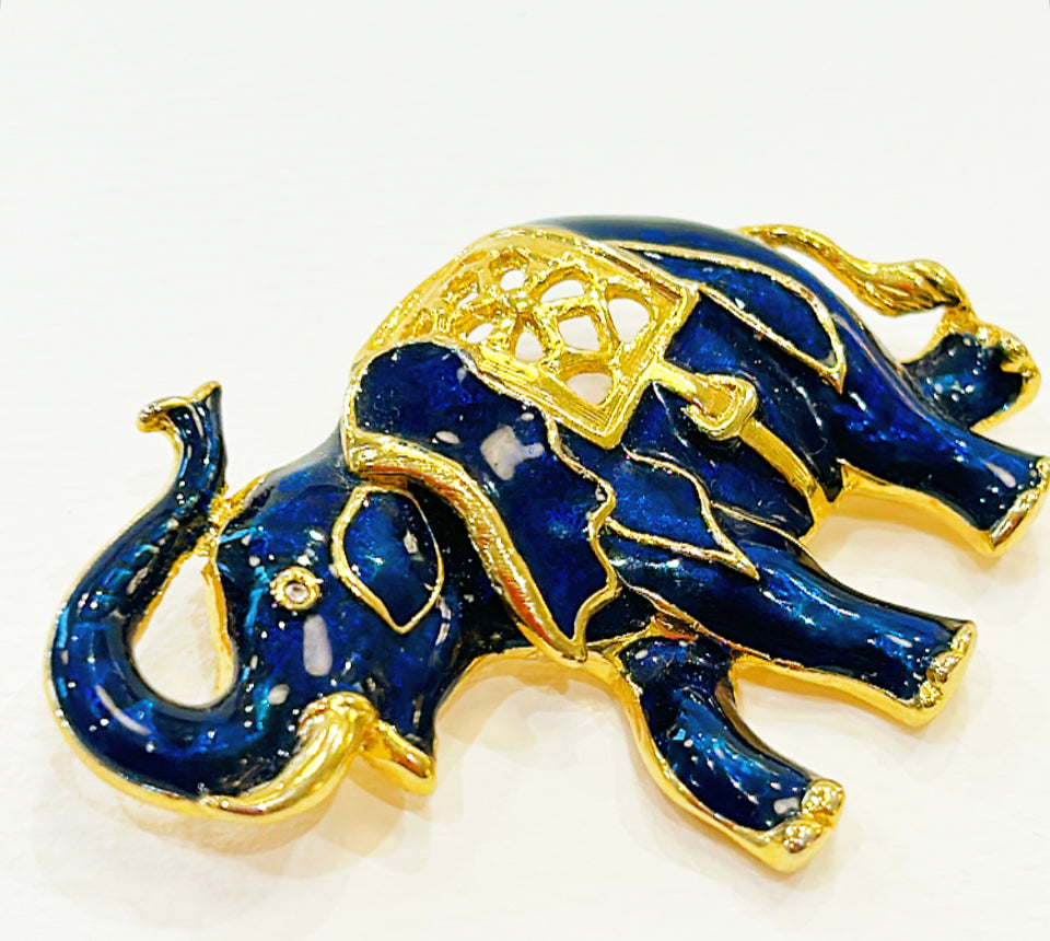 Vintage blue enamel & gold metal elephant brooch.