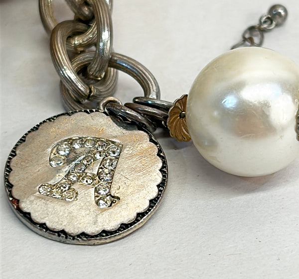 1960s vintage silver chunky monogram charm “A” bracelet with a large faux pearl charm accents.