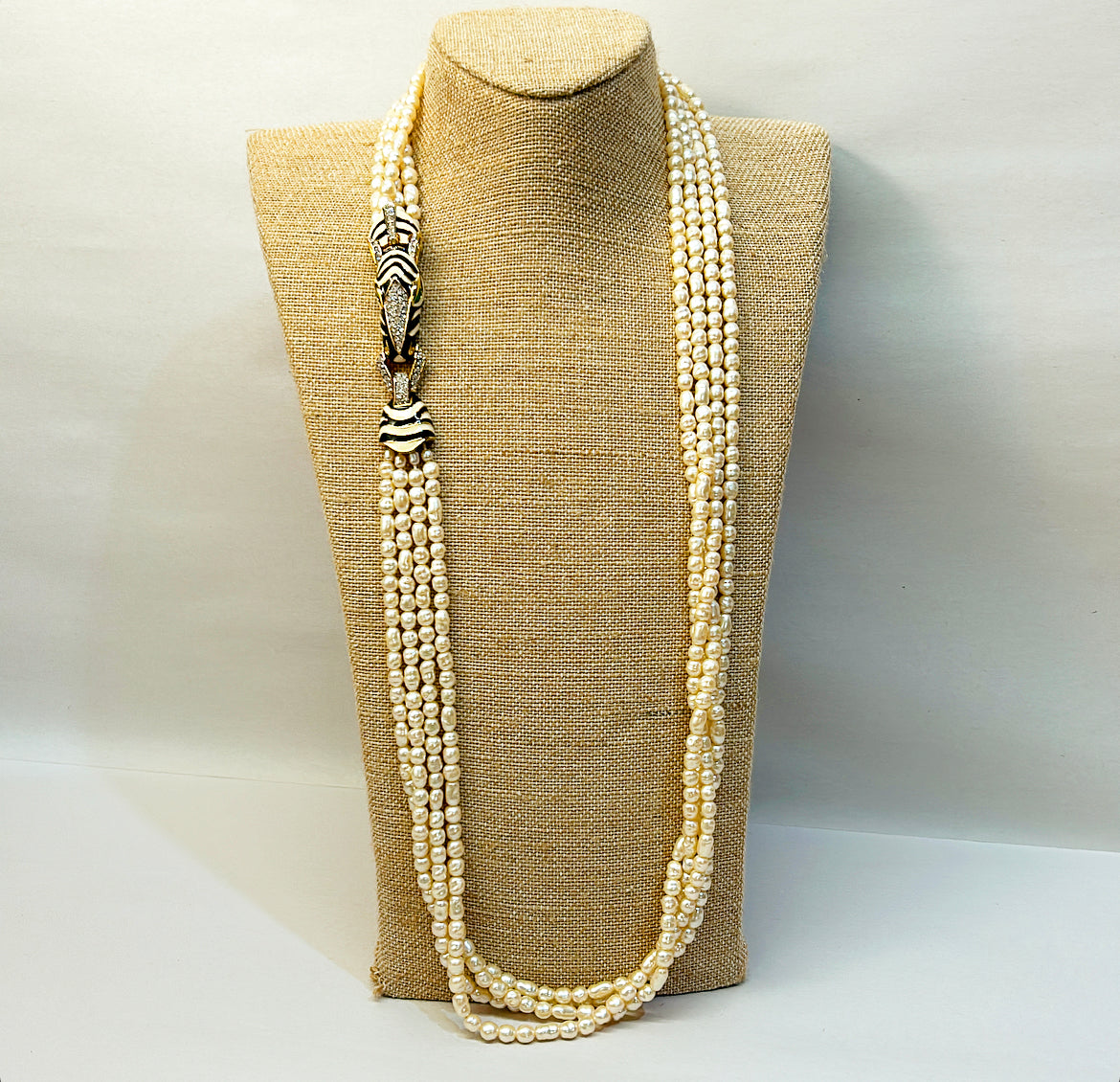Rare vintage signed CINER faux fresh water style pearl necklace with metal zebra statement clasp.
