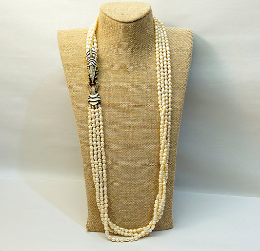Rare vintage signed CINER faux fresh water style pearl necklace with metal zebra statement clasp.