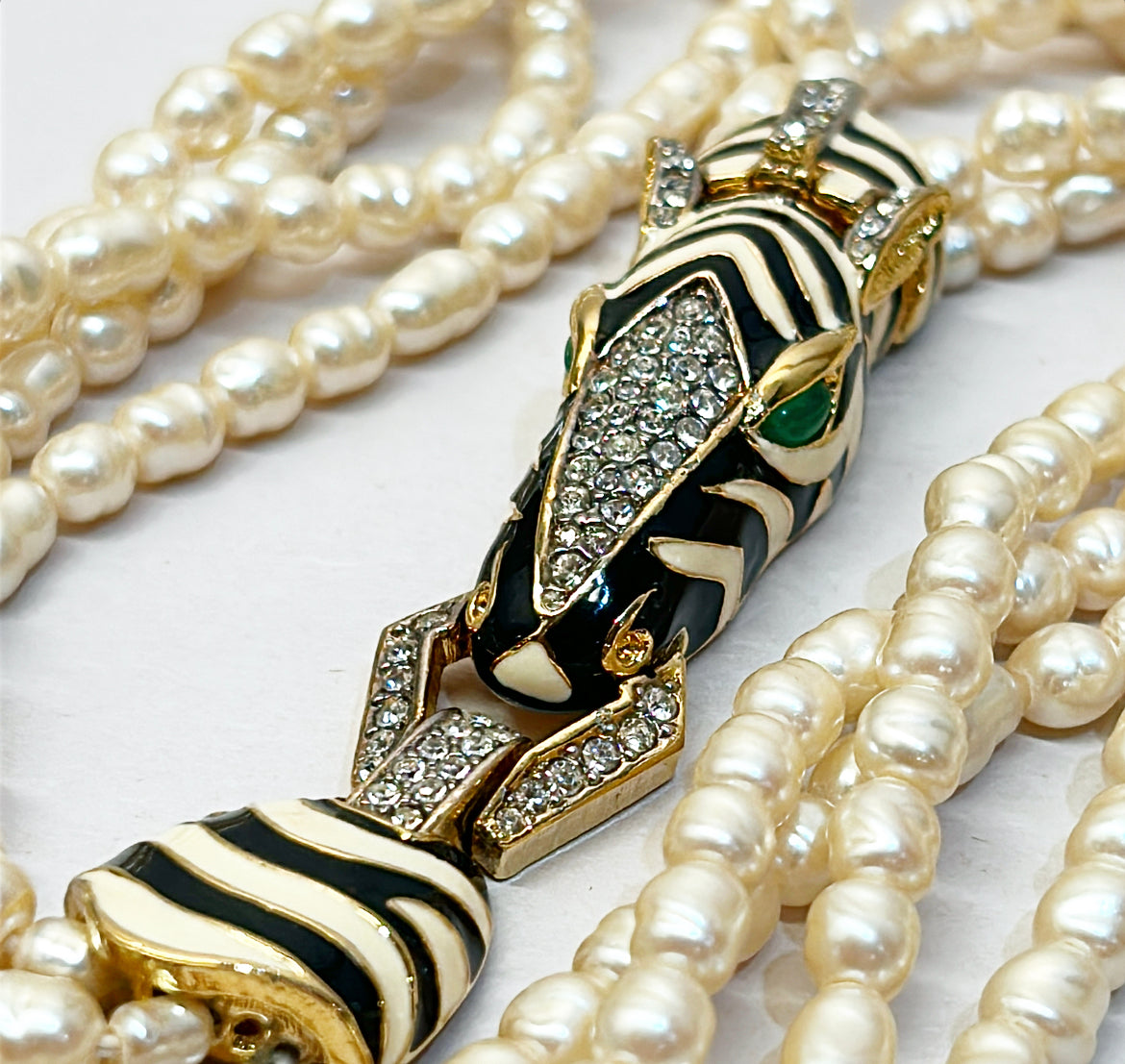 Rare vintage signed CINER faux fresh water style pearl necklace with metal zebra statement clasp.
