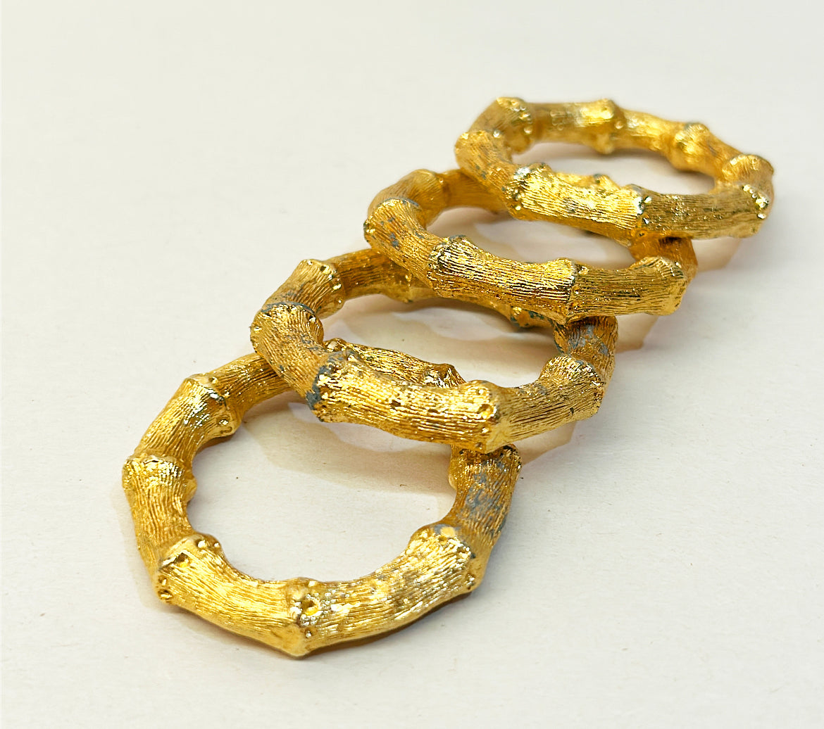 1960s Hollywood regency style faux bamboo gold gilded metal round napkin rings.