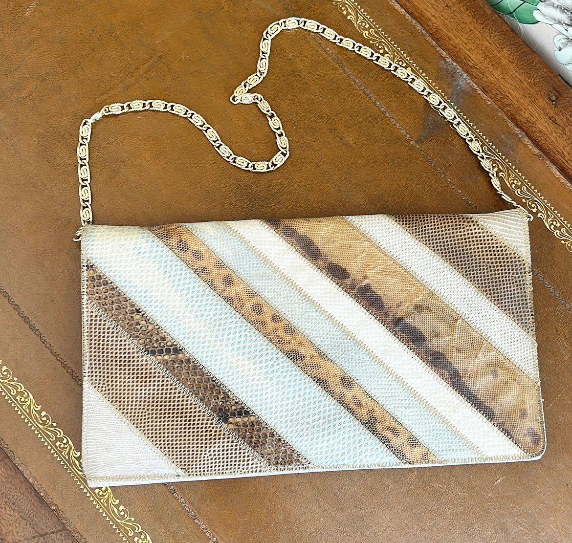 Vintage 1970s snake sink clutch purse with gold chain.