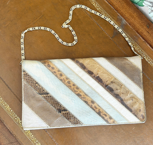 Vintage 1970s snake sink clutch purse with gold chain.