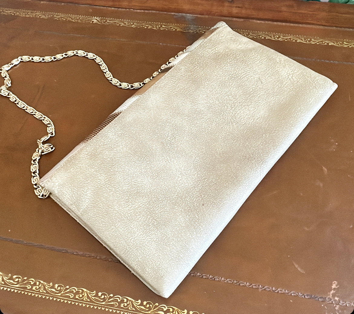 Vintage 1970s snake sink clutch purse with gold chain.