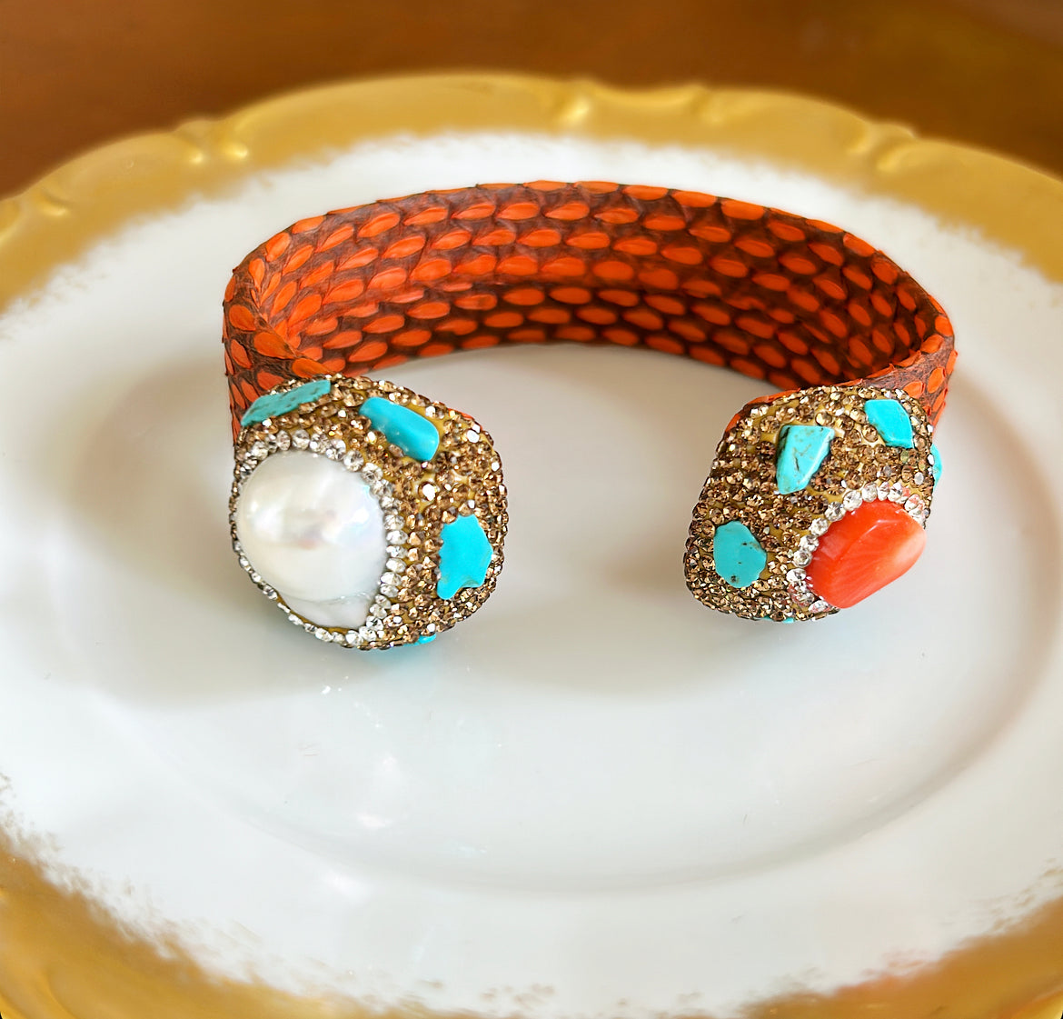 Fabulous statement cuff bracelet with an orange faux skin style banding