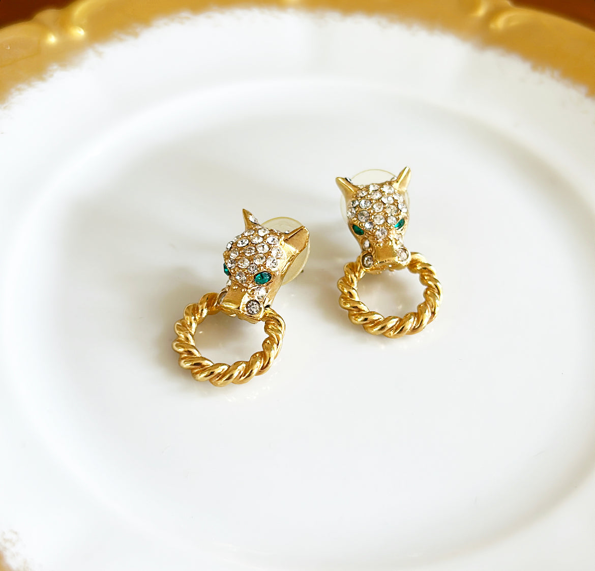 Smaller scale vintage pierced panther head with rings earrings.