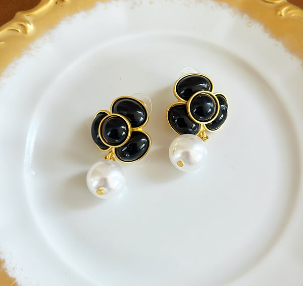 Pierced style flower style earrings with dangling faux pearl base.