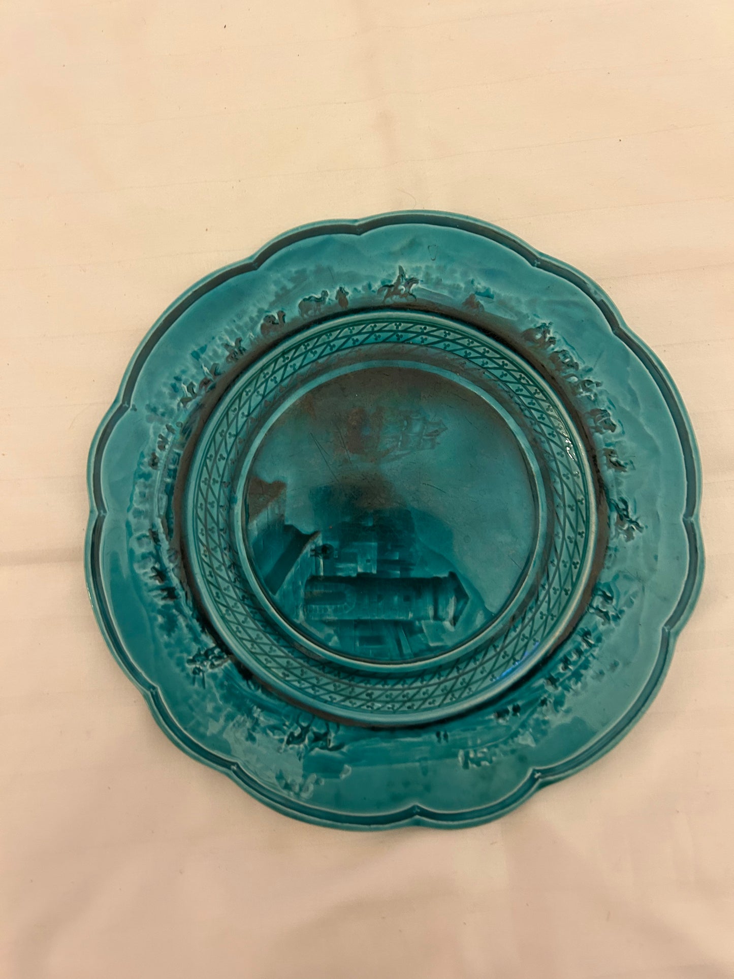 Turquoise ceramic plate is an antique Email Ombrant piece