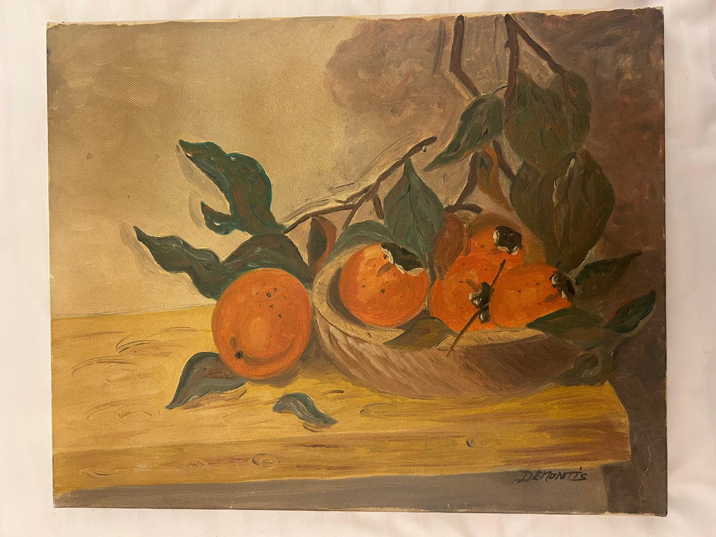 Oil painting is a still life depicting oranges in a container, likely titled "Demontis"