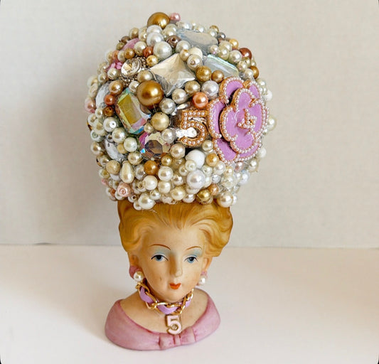 Vintage lady vase with vintage jewelry hat