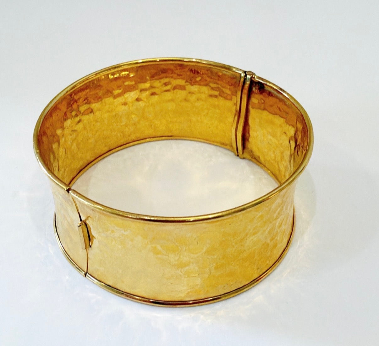 Statement bracelet in a hammered faux gold metal finish