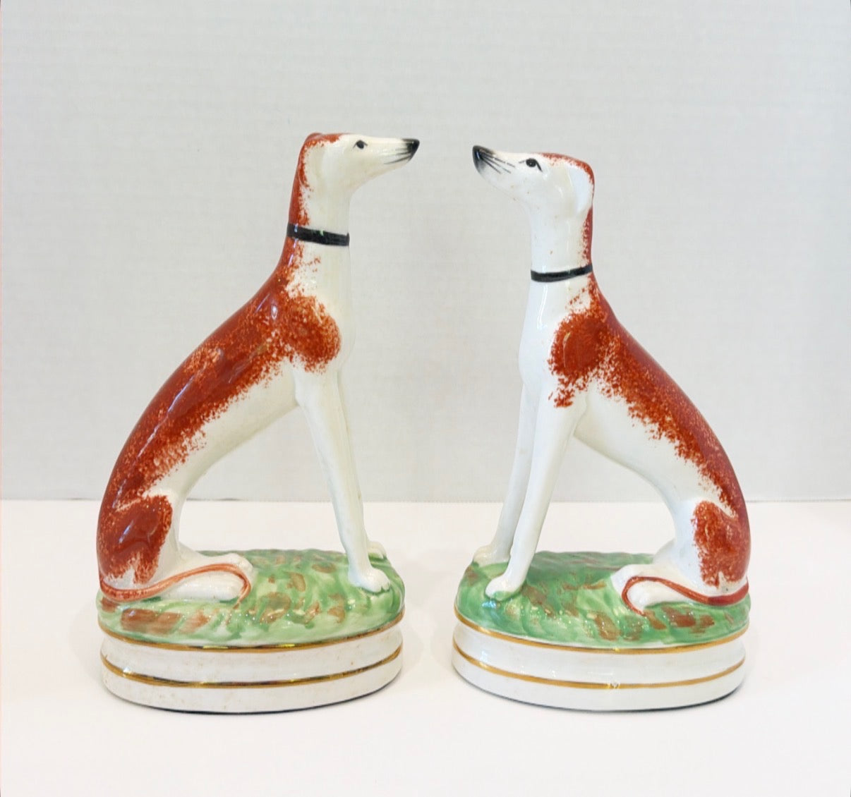 Antique pair of Staffordshire style whippets.