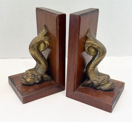Vintage pair of wooden and brass dolphin book ends.