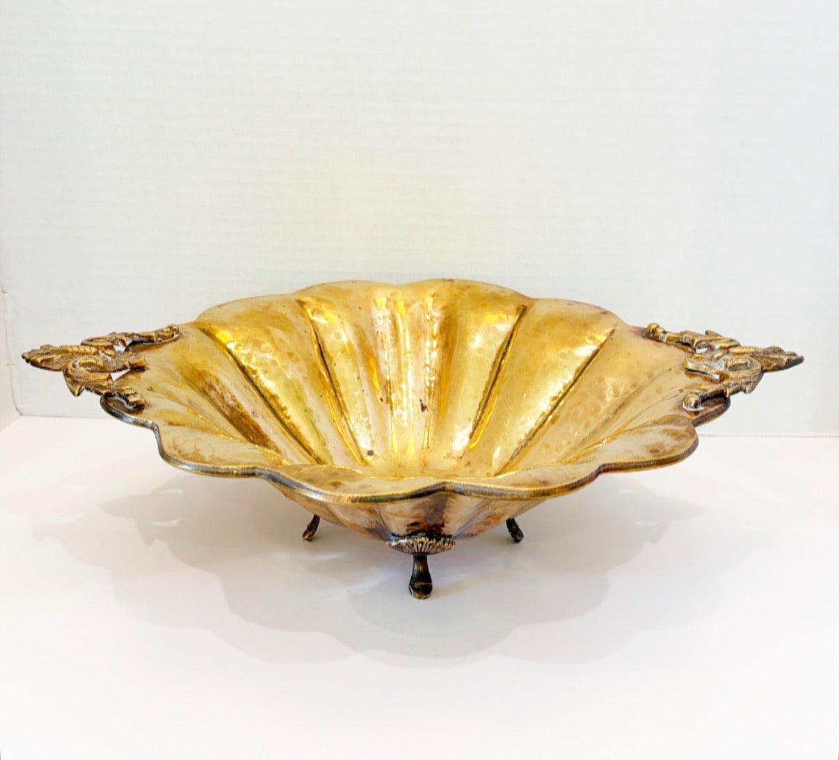 Large footed decorative brass bowl.