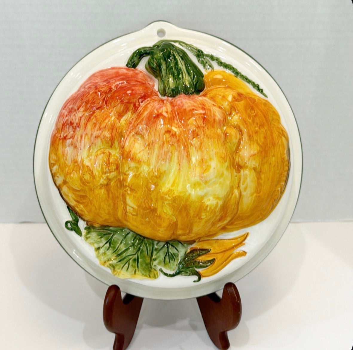 This is a vintage hand-painted Italian ceramic pumpkin mold